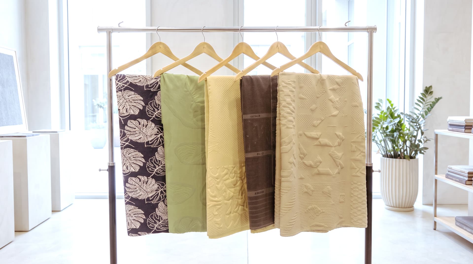 Textile samples displayed on a showroom rack